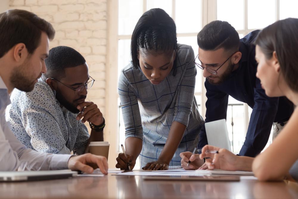 A diverse team of young employees having a meeting