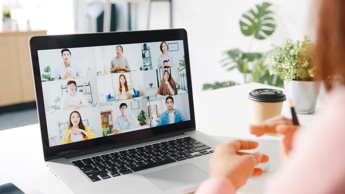 virtual meeting on laptop with many participants