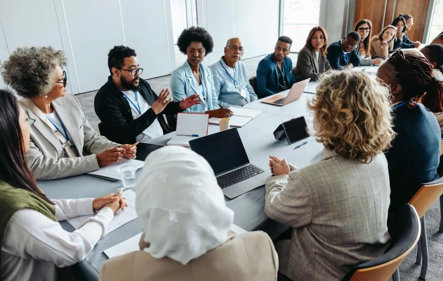 A large diverse group of colleagues engaged in a meeting