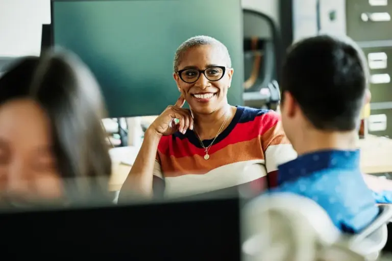 African-American professional discussing with colleagues